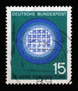 Stamp printed in Germany showing 25th anniv. of publication of Hahn-Strassmann treatise on splitting the nucleus of the atom Royalty Free Stock Photo
