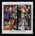 A stamp printed in Germany shows the Annunciation, Stained glass windows in Augsburg Cathedral