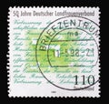 A stamp printed in Germany shows Association Manifesto, 50th anniversary of German Rural Women`s Association