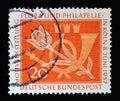 Stamp printed in Germany, shows a post horn and a tulip. The occasion is the motif exhibition flora and philately in Cologne