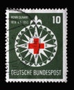 Stamp printed in Germany, shows symbol of the Red Cross in a stylized wind rose