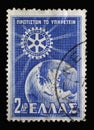 Stamp printed in Greece issued for the 50th anniversary of Rotary International shows Rotary Emblem and Globe