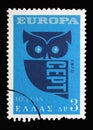 Stamp printed in Greece shows EUROPA/CEPT, Flaming Sun and Owl Royalty Free Stock Photo