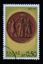 Stamp printed in Greece from the 150th Anniversary of War of Independence shows warriors taking the oath on a medal