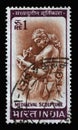 Stamp printed in India shows Woman Writing Letter, Chandella Carving, 11th Century