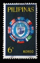 Stamp printed in Philippines shows Flags surrounding SEATO emblem, 10th anniversary SEATO Royalty Free Stock Photo