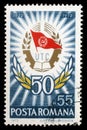 Stamp printed in Romania shows Badge and laurel wreath, 50 Years Communist Youth League