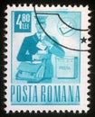 Stamp printed in Romania shows postman Royalty Free Stock Photo