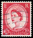 Stamp printed in UK shows portrait of Queen Elizabeth II Royalty Free Stock Photo