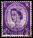 Stamp printed in UK shows portrait of Queen Elizabeth II Royalty Free Stock Photo