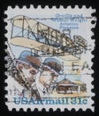 Stamp printed in USA showing Wright brothers and Wright Flyer I plane Royalty Free Stock Photo
