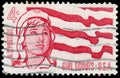 Stamp printed in USA, shows girl scouts and flag