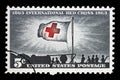 Stamp printed in USA, shows Morning Light and Red Cross Flag Royalty Free Stock Photo