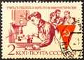 RUSSIA - CIRCA 1961: Stamp printed in the USSR shows communist labor team Publicizing Communist labor teams in their