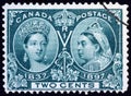 Stamp showing portraits of young and old Queen Victoria