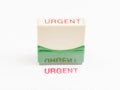 Stamp with urgent in red ink Royalty Free Stock Photo