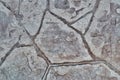 Stamped concrete mosaic patterns, earth tone colors and textures from directly above. Royalty Free Stock Photo
