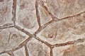 Stamped concrete mosaic patterns, earth tone colors and textures from directly above. Royalty Free Stock Photo