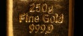 Stamped writing on a cast fine gold bar, also known as gold bullion