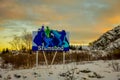 STAMSUND, LOFOTEN, NORWAY, APRIL, 09, 2018: Outdoor view of huge placard of diferent images in a gorgeous sunset