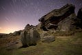 Stanage edge mill stones and star trails Royalty Free Stock Photo