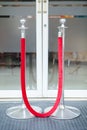 Stanchion or stand barriers in front of a door entrance