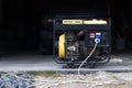 Stand-alone diesel generator to supply electricity in an emergency. Yellow color. Serves not a large residential building Royalty Free Stock Photo