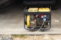 Stand-alone diesel generator to supply electricity in an emergency. Yellow color. Serves not a large residential building Royalty Free Stock Photo