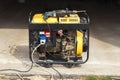 stand-alone diesel generator to supply electricity in an emergency. Yellow color. Serves not a large residential building. On it Royalty Free Stock Photo