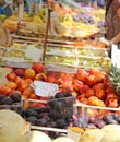 Stand with basket full of seasonal fruits in the local market of Royalty Free Stock Photo