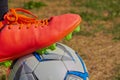 Stand with boots on the ball,feet of football player tread on soccer ball for kick-off Royalty Free Stock Photo