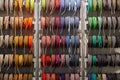 Stand with coils of multicolored textile braided cables
