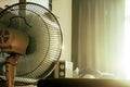 Stand electronic fan in room in morning