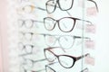 On stand are glasses in beautiful frames. closeup