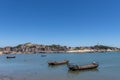 Stand high and watch the sea scenery under the blue sky, blue water, white waves and black rocks Royalty Free Stock Photo