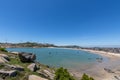 Stand high and watch the sea scenery under the blue sky, blue water, white waves and black rocks Royalty Free Stock Photo