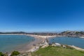 Stand high and watch the sea scenery under the blue sky, blue water, white waves and black rocks Royalty Free Stock Photo