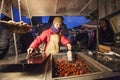 Stand with hot chestnut - winter specialty during christmas in Prague Royalty Free Stock Photo