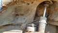 A stand of an old and rusty car closeup. Auto part close-up. A wrecked car at a car service is not subject to restoration and