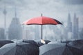 Stand out from the crowd concept with red umbrella above lots of black one under the rain. Royalty Free Stock Photo