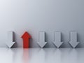 Stand out from the crowd and different concept One red up arrow among other down arrows on white wall background Royalty Free Stock Photo