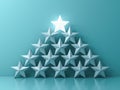 Stand out from the crowd and Leadership creative idea concepts One glowing light star standing on top of other dim stars on green Royalty Free Stock Photo