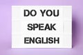 Stand with question Do You Speak English on violet background Royalty Free Stock Photo