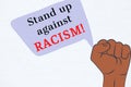 Stand up against Racism Illustration showing 3 different colored fists in protest. There is a huge protest going on in many cities