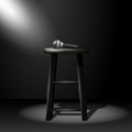 Stand up comedy stage - microphone on stool in ray of spotlight Royalty Free Stock Photo