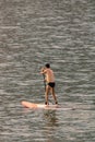 Stand up paddle board man paddleboarding . Young caucasian male model on Copacabana beach on summer holidays vacation trave Royalty Free Stock Photo