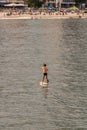 Stand up paddle board man paddleboarding . Young caucasian male model on Copacabana beach on summer holidays vacation trave Royalty Free Stock Photo