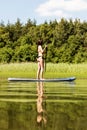 Stand up paddle board woman paddleboarding on SUP Royalty Free Stock Photo