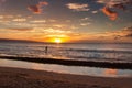 Stand up paddler at a beach, at sunset, on Maui. Royalty Free Stock Photo