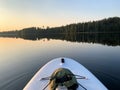 Stand up paddling in the evening and water is like a mirror